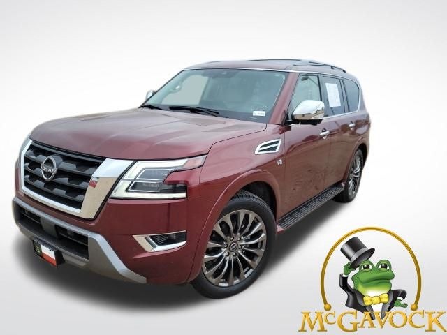 2021 Nissan Armada Platinum in Coulis Red Pearl — front three-quarter view