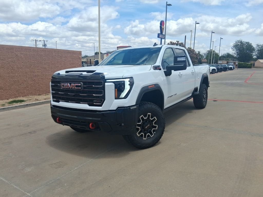 2026 GMC Sierra 2500 HD AT4X in Summit White — front three-quarter view