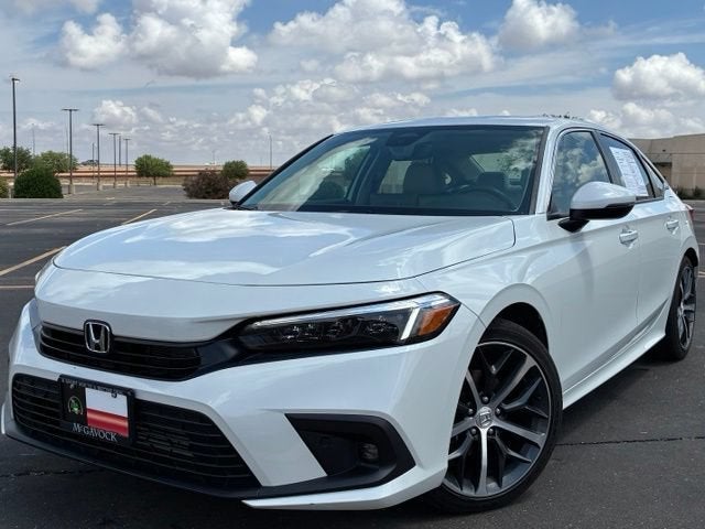 2024 Honda Civic Sedan Touring in White — front three-quarter view