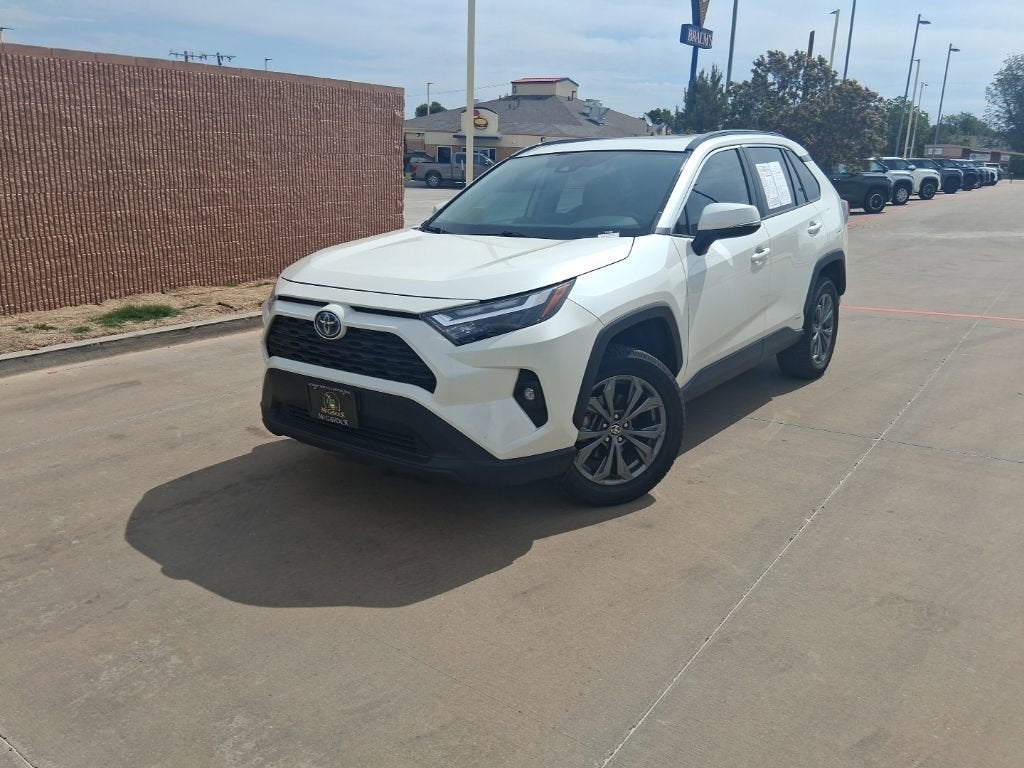2022 Toyota RAV4 Hybrid XLE Premium in Blizzard Pearl — front three-quarter view
